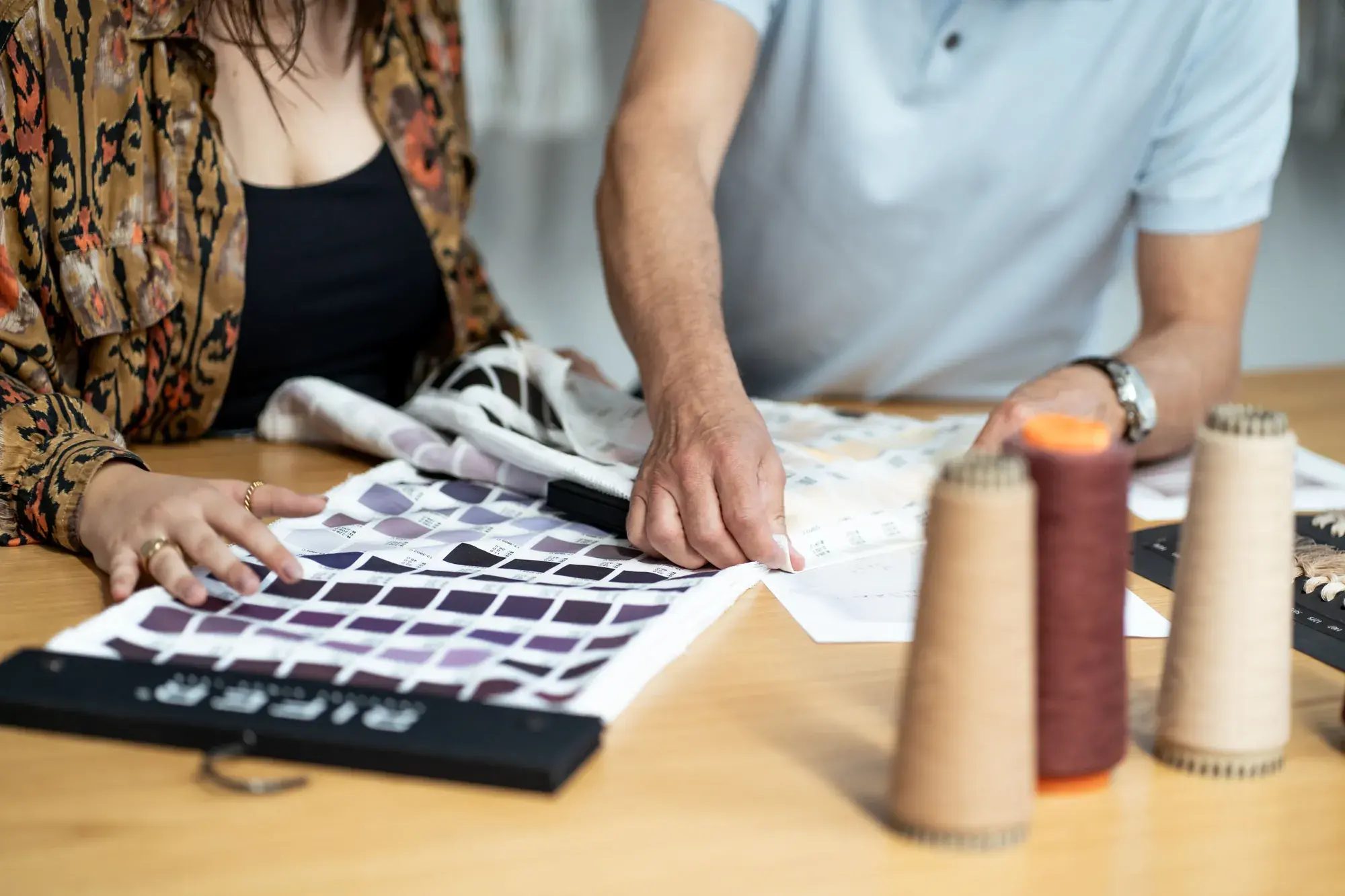 Two RIFER specialists analysing fabric constructions