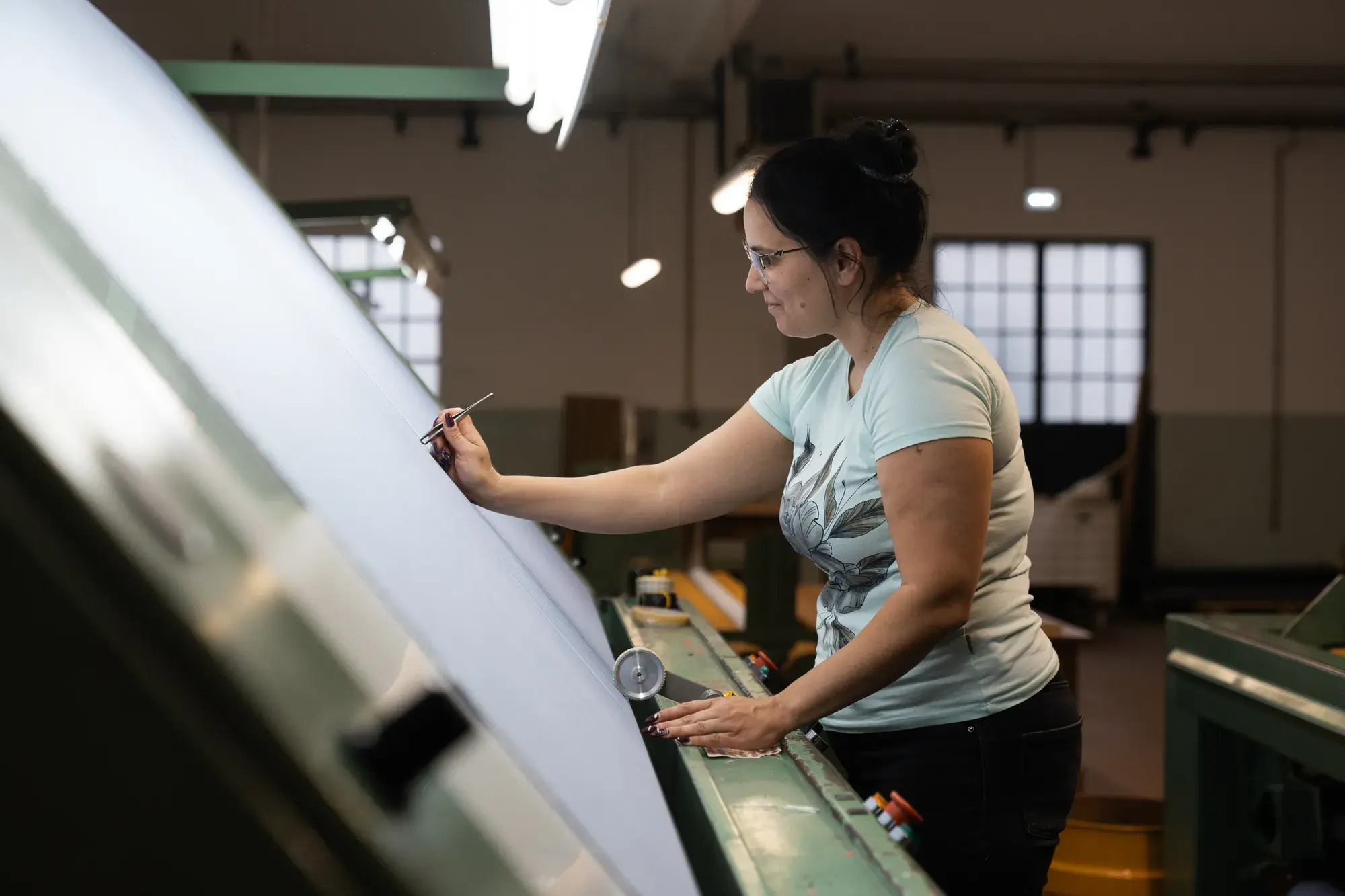 A RIFER specialist sewing on the production floor